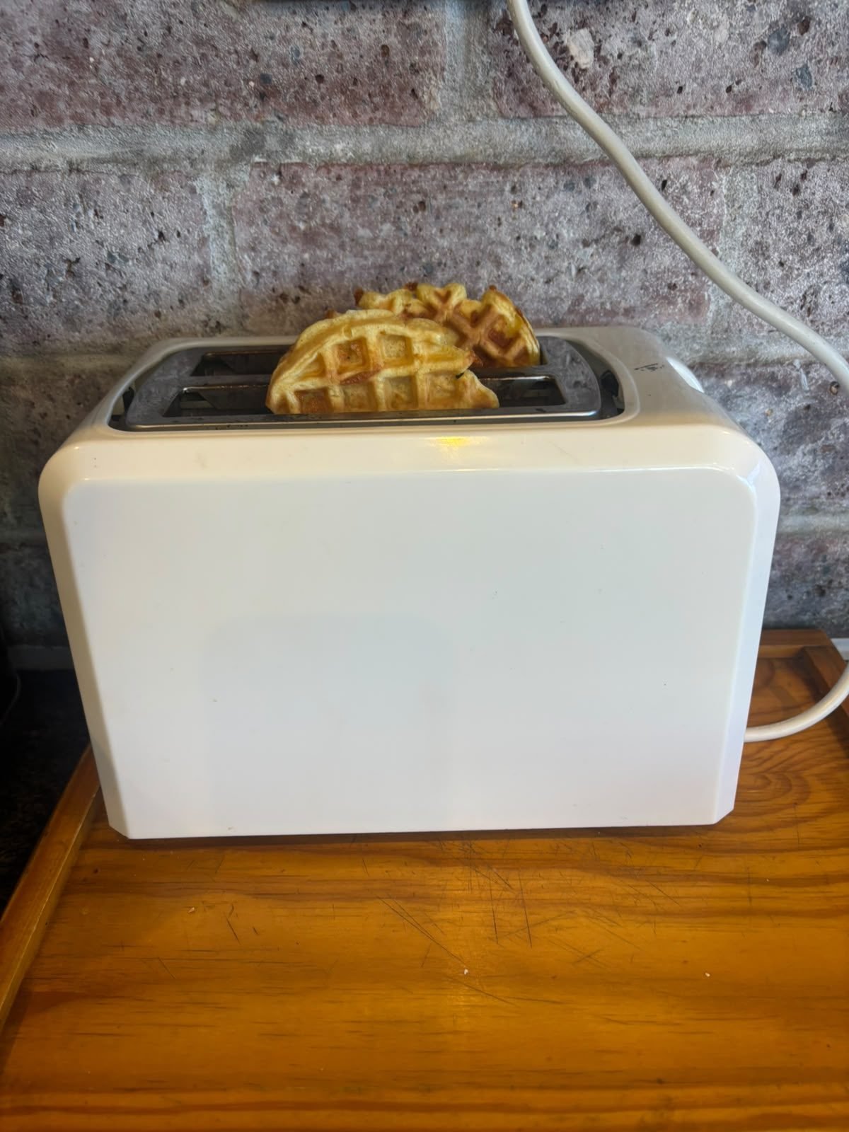 Protein waffles toasting in a toaster straight from the freezer